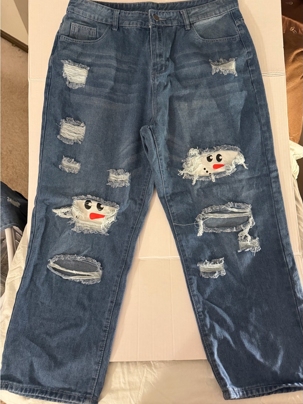 Womaen's Dark Blue Distressed Jeans with Playful Patch Detail